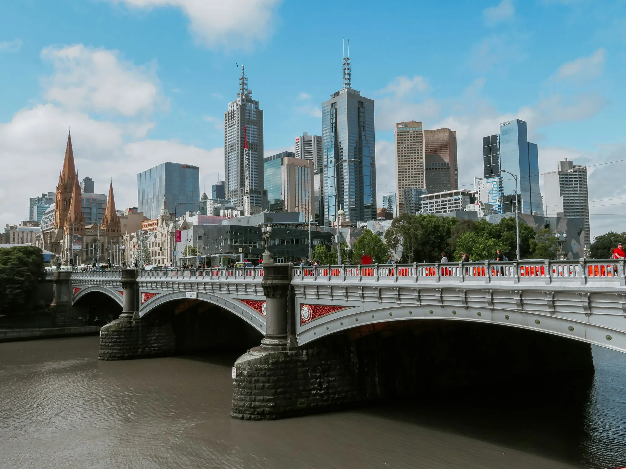 Princes Bridge over the Yarra River, with the Melbourne city skyline behind it.